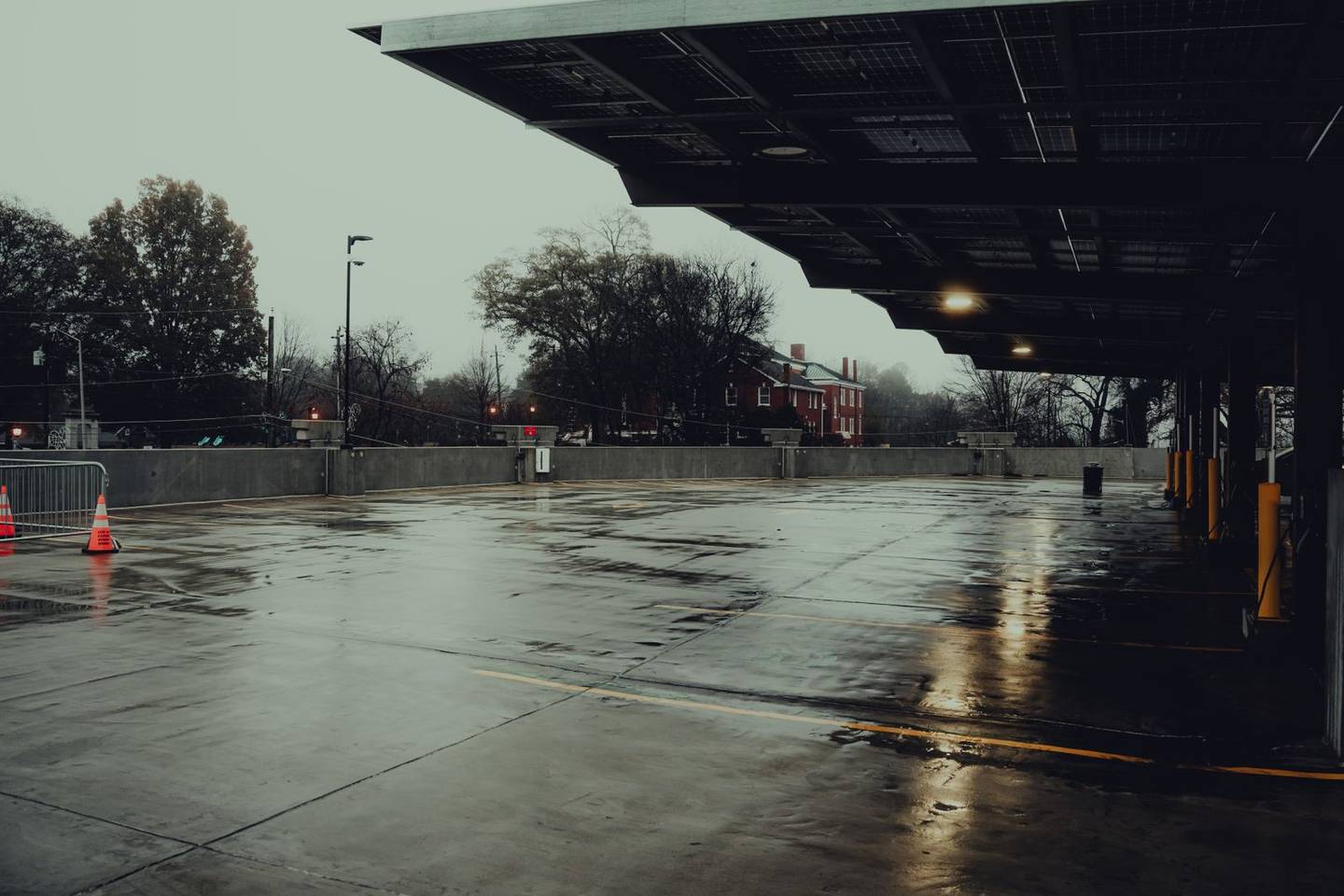 Wet parking lot after rain showing weather impact on asphalt
