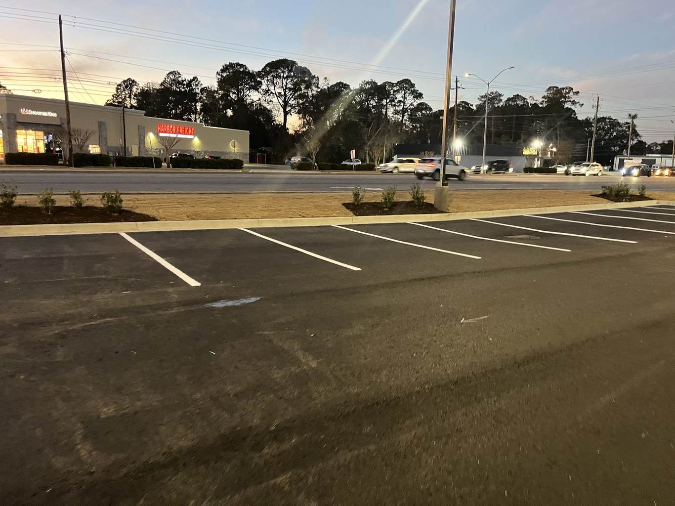 Freshly paved and striped commercial parking lot by Biran Paving Group in Metro Atlanta